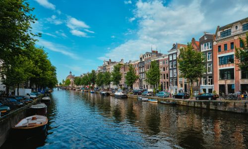 Singel canal in Amsterdam with old houses. Amsterdam, Netherlands